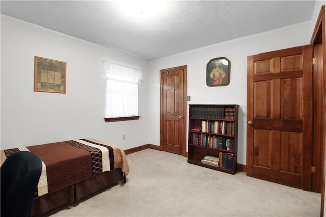 bedroom featuring light carpet