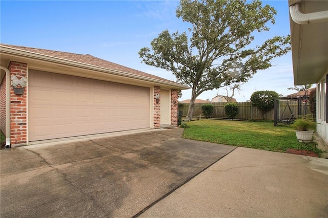 garage with a lawn