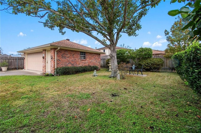 view of home's exterior with a yard and a garage