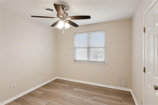 empty room featuring ceiling fan and light hardwood / wood-style floors