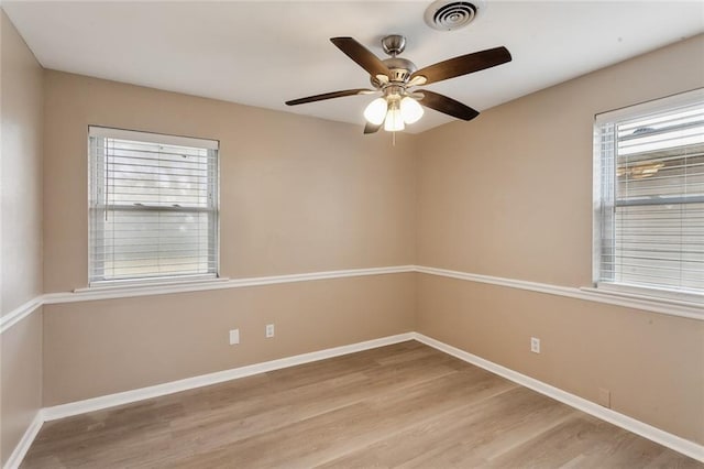 empty room featuring ceiling fan and light hardwood / wood-style floors