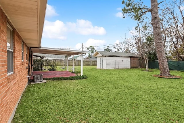 view of yard with a patio area and a storage unit