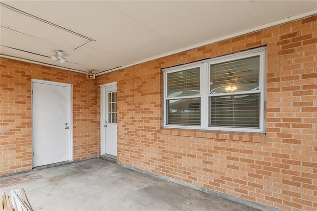 entrance to property featuring a patio area