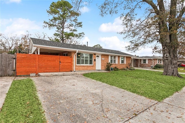 single story home with a front lawn and a carport