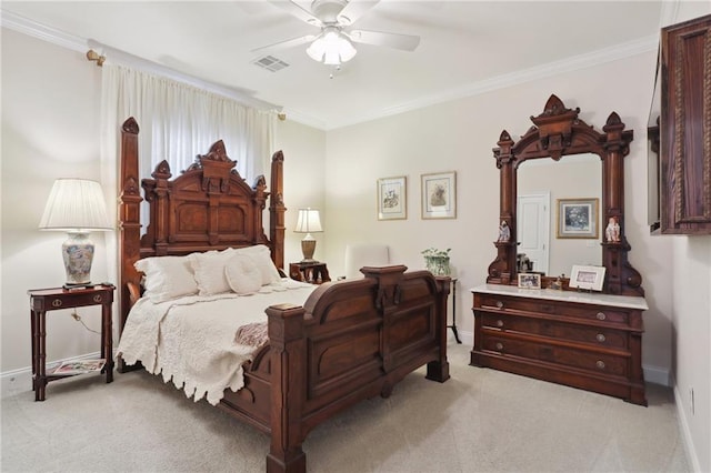 carpeted bedroom with crown molding and ceiling fan