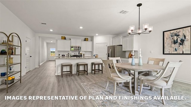 dining room featuring recessed lighting, an inviting chandelier, light wood-type flooring, visible vents, and baseboards