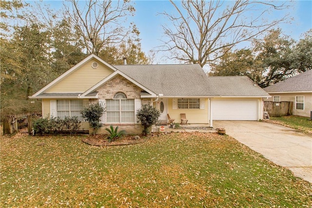 ranch-style house featuring a garage and a front yard