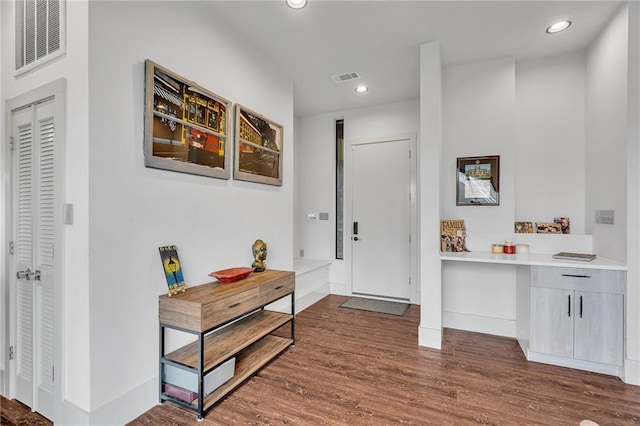 foyer with dark wood-type flooring