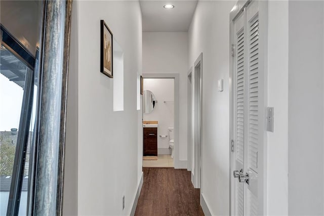 hall with dark hardwood / wood-style flooring