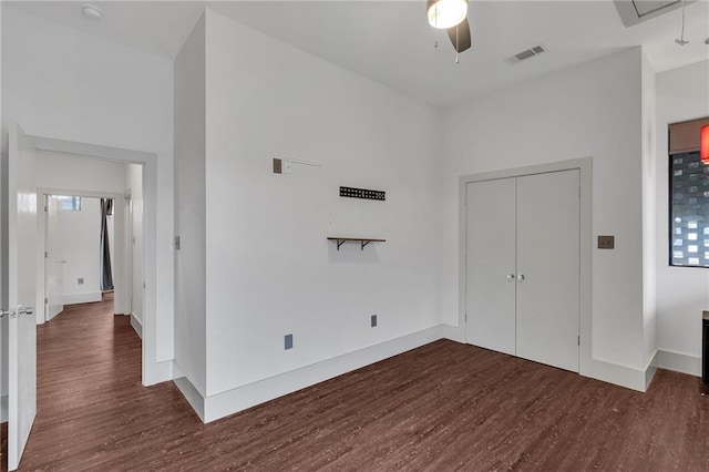 interior space featuring ceiling fan and dark hardwood / wood-style flooring