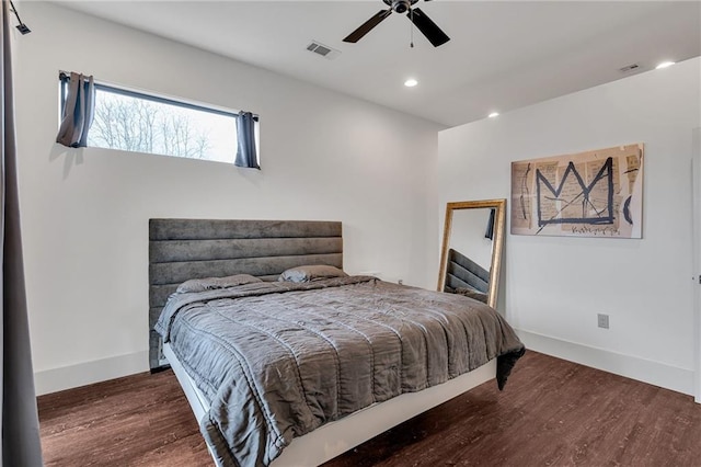 bedroom featuring dark hardwood / wood-style flooring and ceiling fan