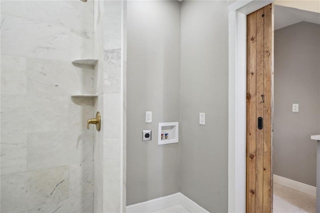 clothes washing area with hookup for an electric dryer, baseboards, laundry area, and hookup for a washing machine