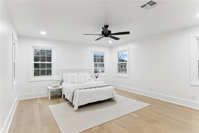 bedroom featuring ceiling fan and light wood-type flooring