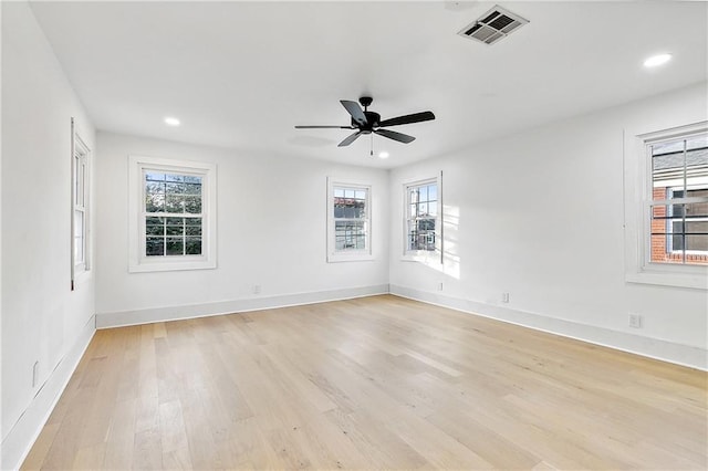 unfurnished room featuring ceiling fan and light wood-type flooring