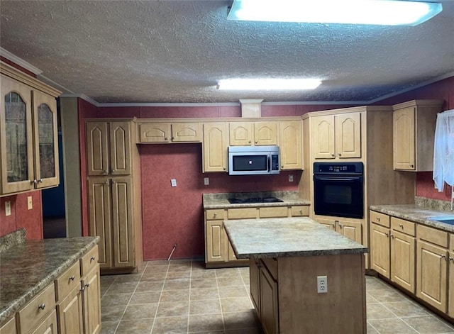 kitchen featuring glass insert cabinets, a center island, a textured ceiling, and black appliances