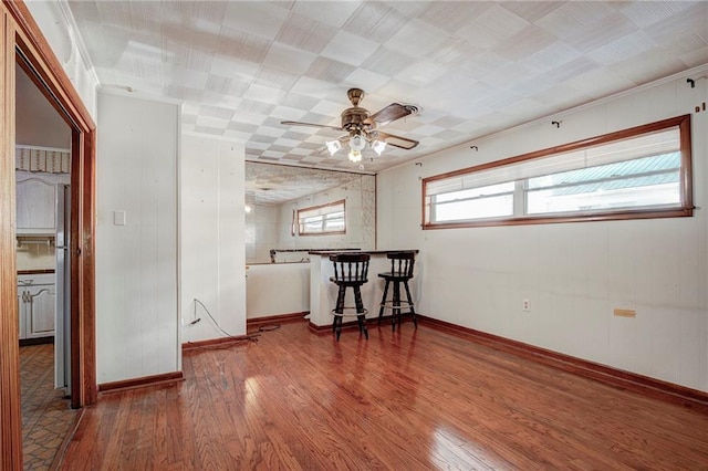 unfurnished room with hardwood / wood-style floors and ceiling fan