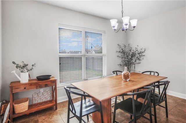 dining area with a notable chandelier and tile patterned floors