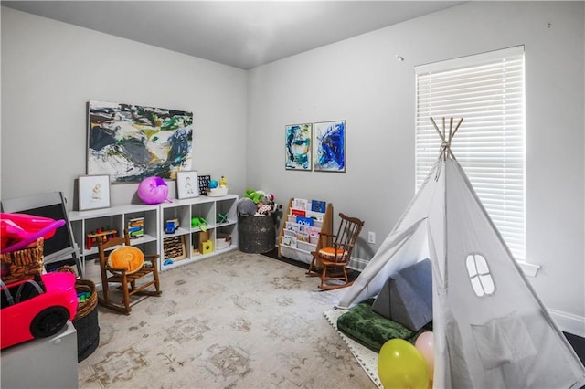 game room featuring light colored carpet