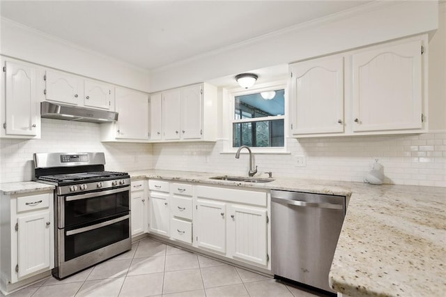 kitchen featuring appliances with stainless steel finishes, sink, and white cabinets