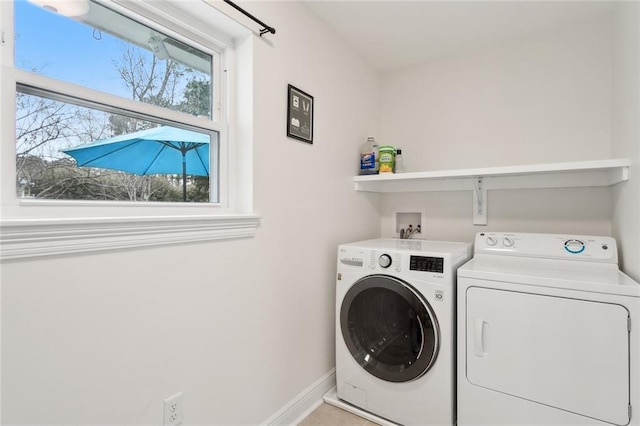 laundry area with washing machine and clothes dryer