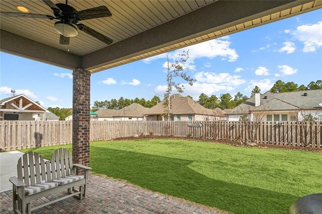 view of yard featuring ceiling fan and a patio area