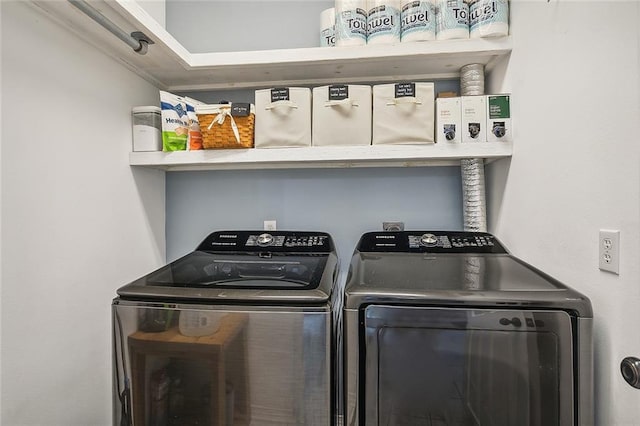 washroom featuring washer and dryer