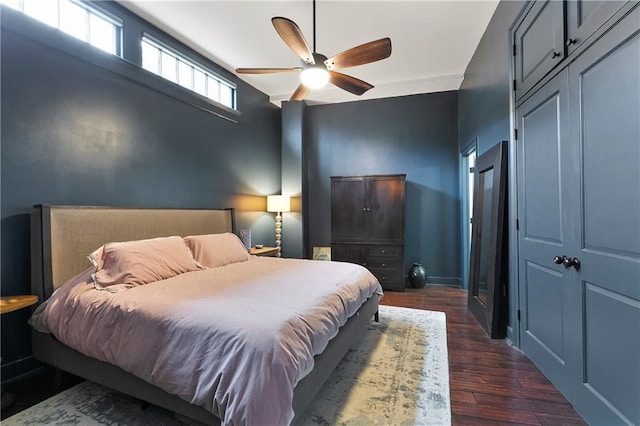 bedroom featuring dark wood-type flooring and ceiling fan