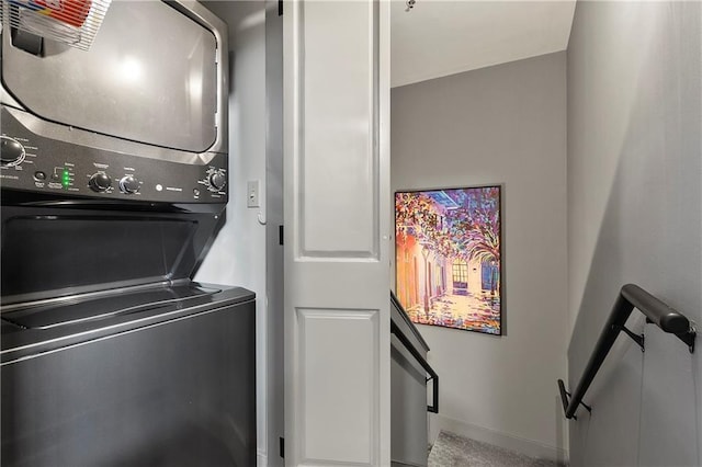 laundry room featuring stacked washer / dryer