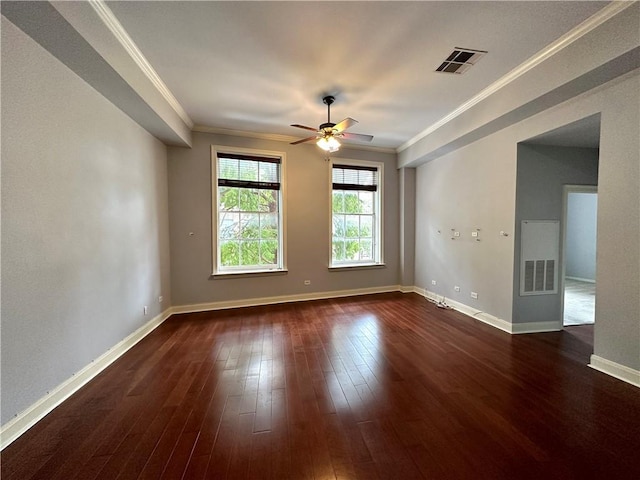 330 Julia St Unit 205, New Orleans, LA 70130 - spare room featuring crown molding, dark wood finished floors, a ceiling fan, baseboards, and visible vents