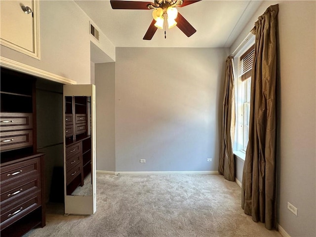 330 Julia St Unit 205, New Orleans, LA 70130 - unfurnished bedroom with baseboards, ceiling fan, light carpet, and visible vents