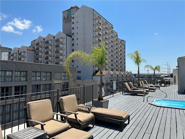 330 Julia St Unit 205, New Orleans, LA 70130 - wooden deck featuring a community pool
