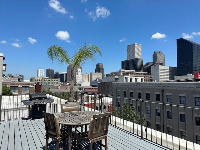 330 Julia St Unit 205, New Orleans, LA 70130 - wooden terrace with a view of city and a grill