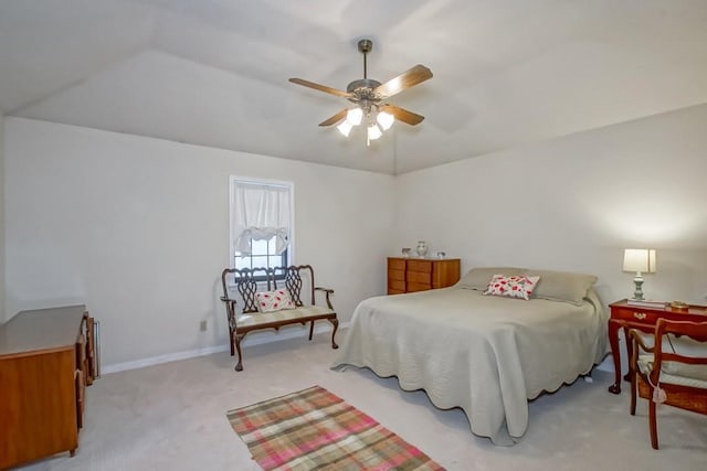 bedroom featuring light carpet, lofted ceiling, and ceiling fan