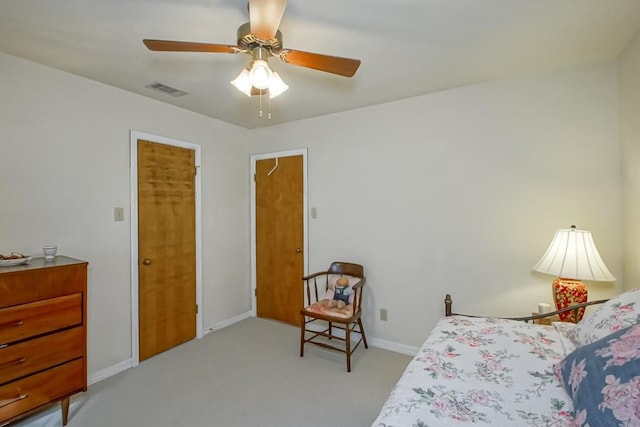 bedroom featuring light colored carpet and ceiling fan