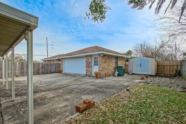 exterior space featuring a garage and a shed