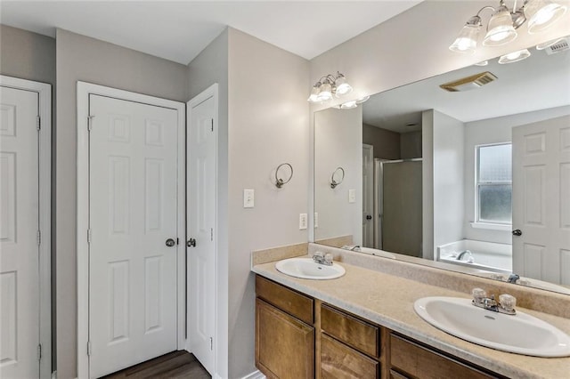 bathroom with vanity and plus walk in shower