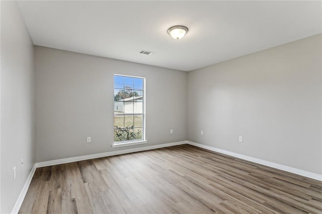 empty room with light wood-type flooring