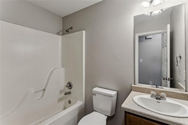 full bathroom featuring shower / bathtub combination, vanity, and toilet