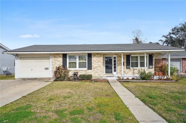 ranch-style house with a garage, a front lawn, and covered porch