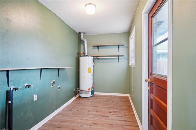 laundry area with hookup for a washing machine, electric dryer hookup, light wood-type flooring, and gas water heater