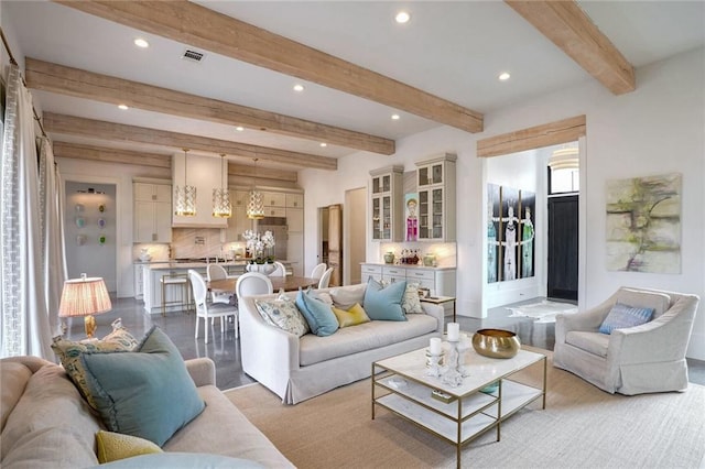 living room with beam ceiling