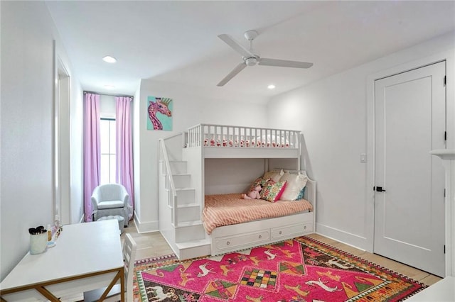 bedroom featuring ceiling fan and light hardwood / wood-style flooring