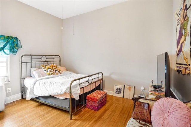 bedroom with hardwood / wood-style flooring