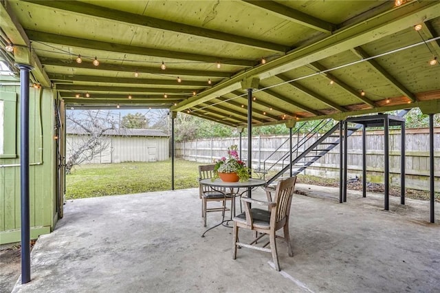 view of patio / terrace with a storage unit