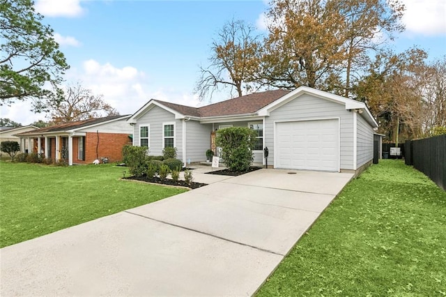 ranch-style home featuring a garage and a front lawn