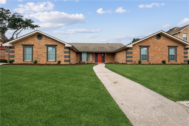 ranch-style home with a front lawn