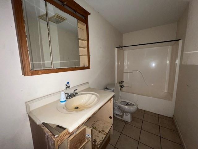 full bathroom featuring vanity, tub / shower combination, tile patterned floors, and toilet