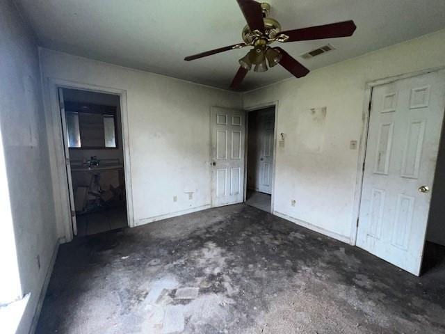 unfurnished bedroom featuring ceiling fan