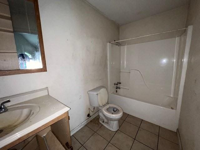 full bathroom featuring vanity, toilet, tile patterned flooring, and shower / bathing tub combination