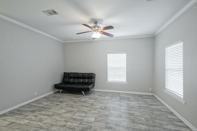 unfurnished room with ceiling fan, plenty of natural light, light hardwood / wood-style floors, and ornamental molding